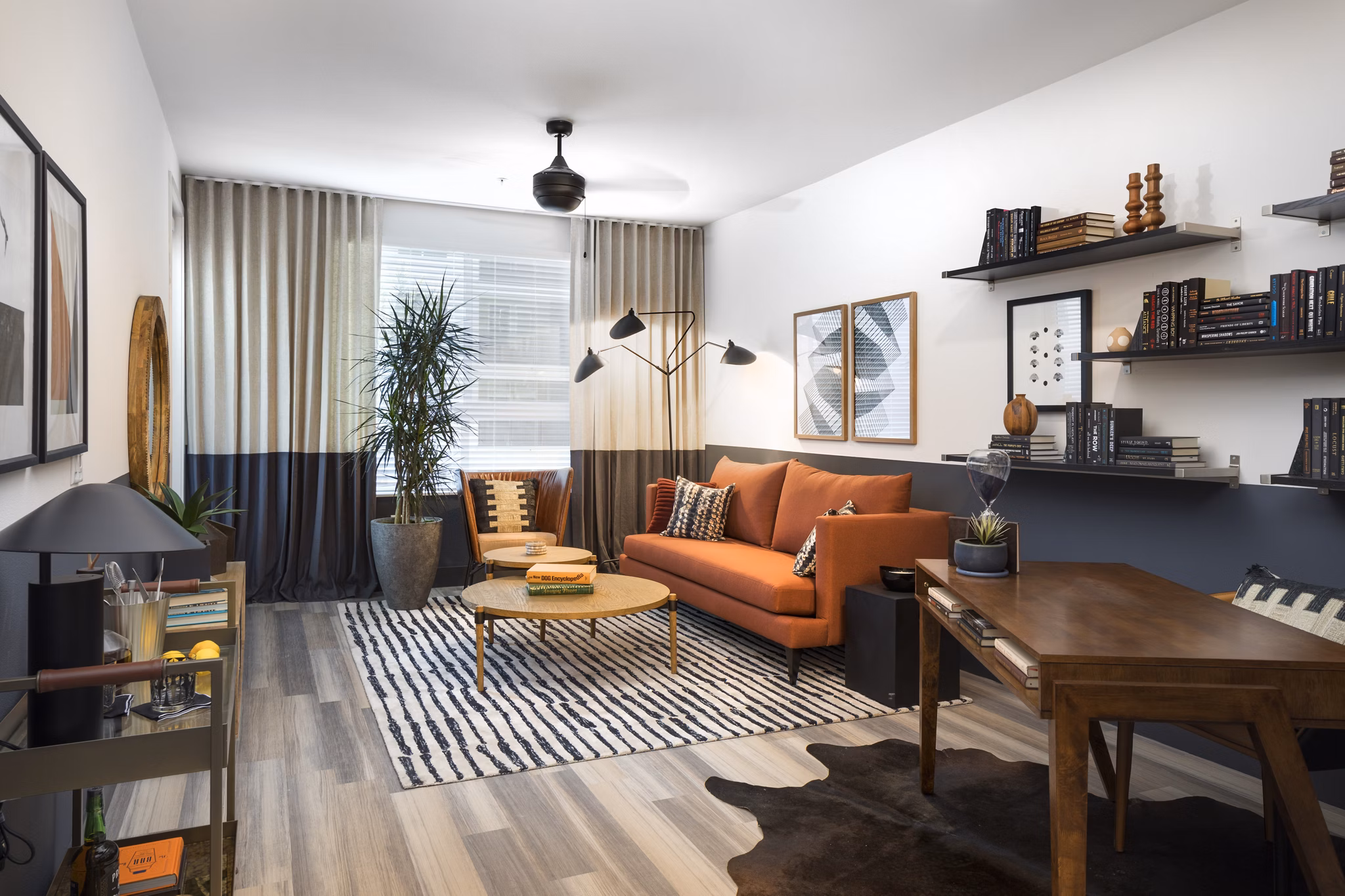 Spacious living room with modern decor and large windows at Jefferson Edge Apartments