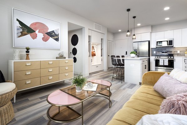 Living room featuring modern decor and natural lighting at Jefferson Edge Apartments
