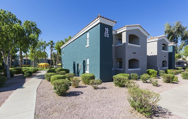 Morada West Apartments: Elegant facade of luxury property in a serene neighborhood