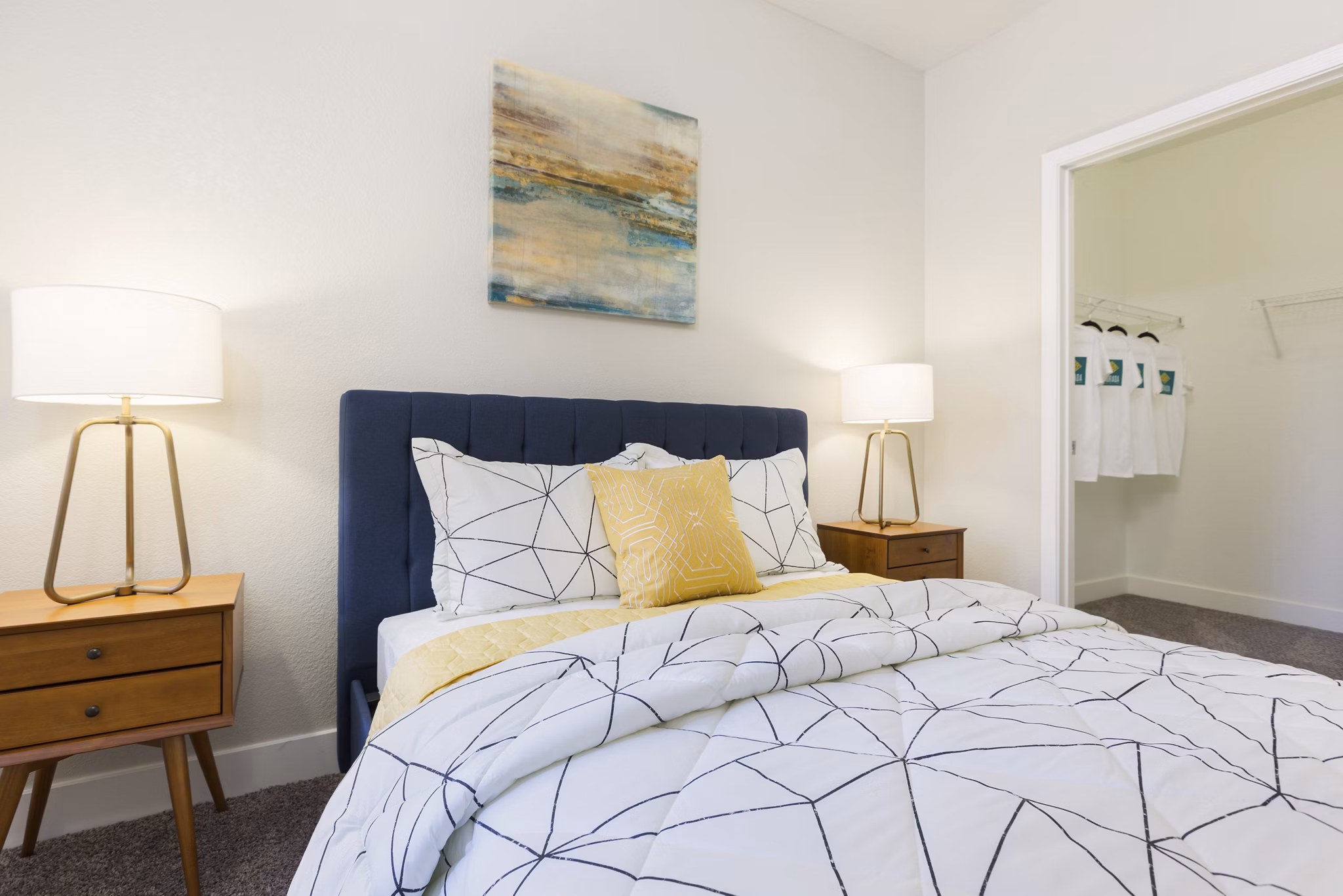 Cozy bedroom with modern furnishings at Morada West Apartments