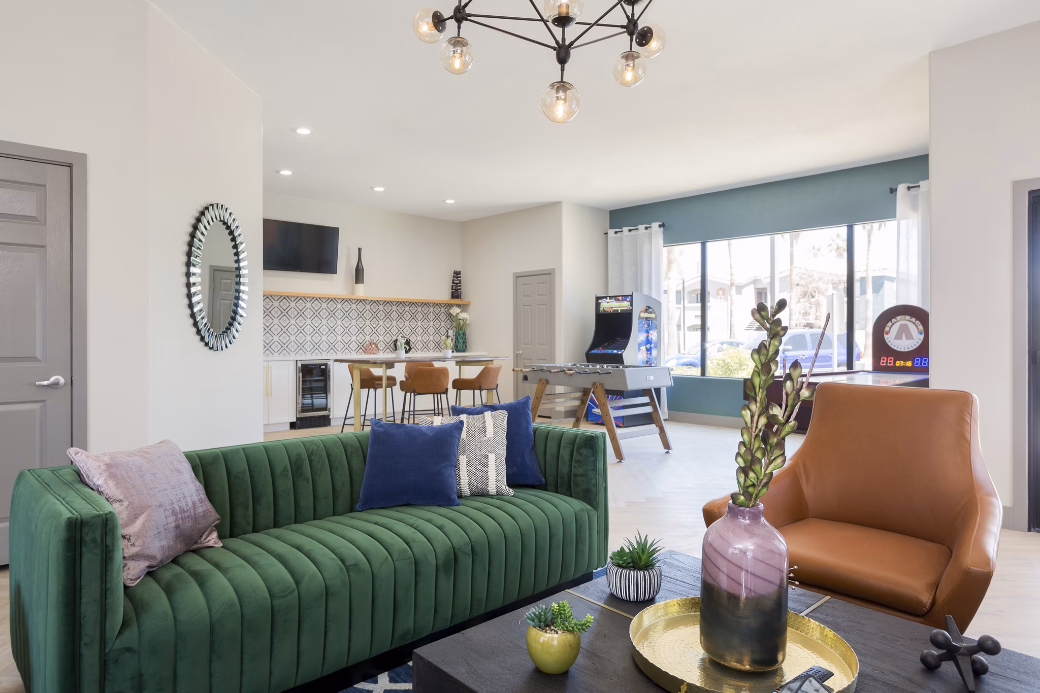 Modern clubhouse with stylish seating and pool table at Morada West Apartments