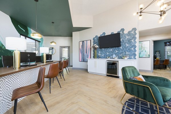 Clubhouse at Morada West Apartments: Luxury social space with modern decor and community seating