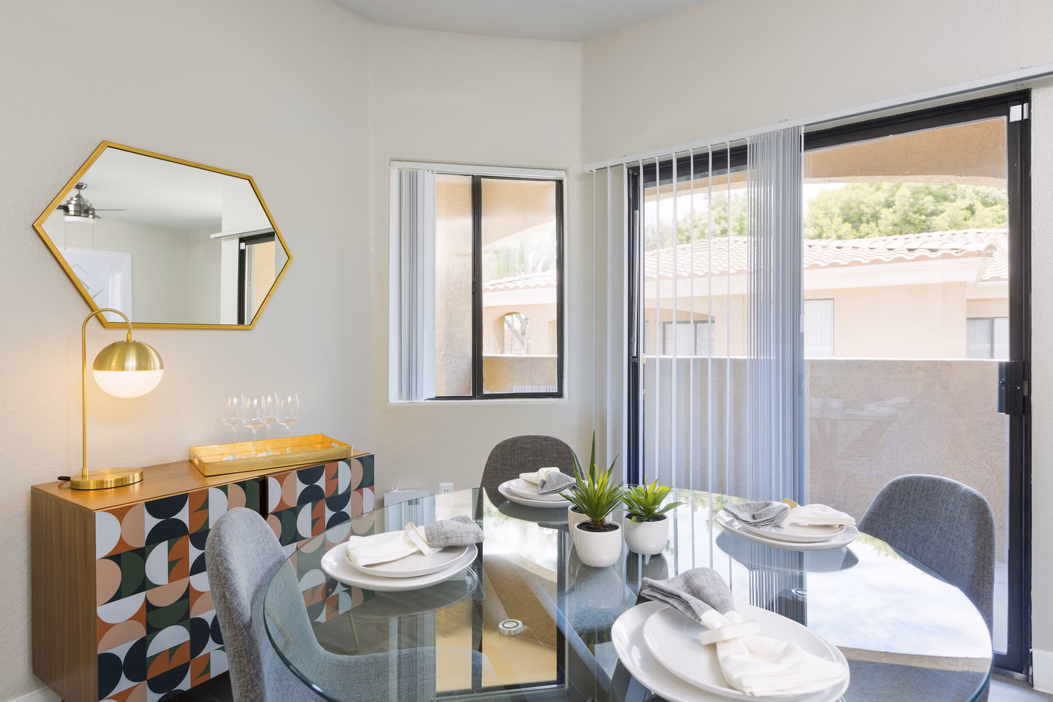 Dining room featuring elegant furnishings and modern lighting at Morada West Apartments