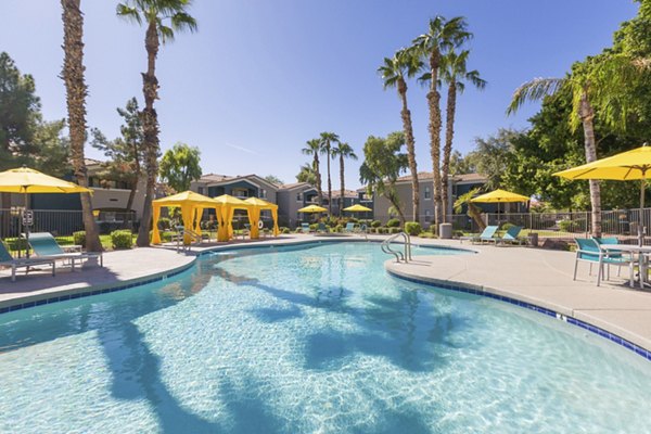 Modern pool with lounge chairs at Morada West Apartments, a luxury Greystar property