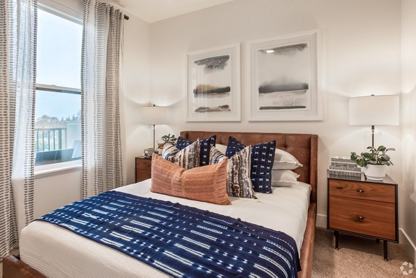 Modern bedroom with sleek furnishings at Gio Apartments