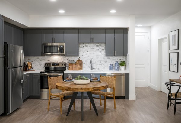 Chic dining area with modern furnishings at Gio Apartments, showcasing luxury lifestyle in Greystar properties