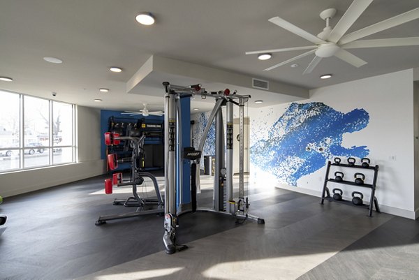 Modern fitness center with state-of-the-art equipment at Gio Apartments Enjoy luxury amenities and active living