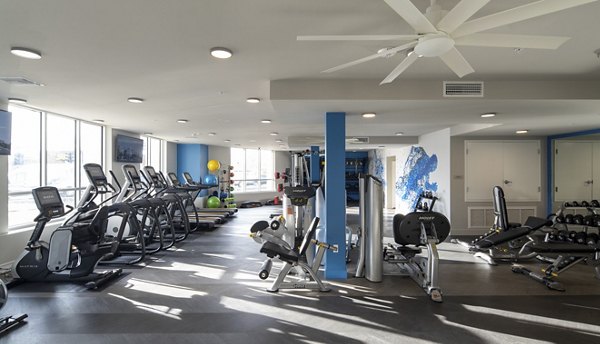 State-of-the-art fitness center featuring modern equipment at Gio Apartments