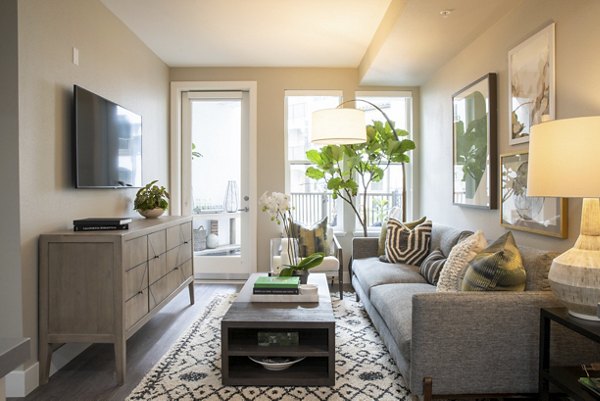 Spacious living room featuring modern design elements at Gio Apartments