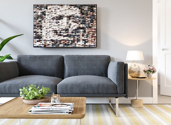 Spacious living room with modern decor and natural light at Gio Apartments, a Greystar luxury apartment community