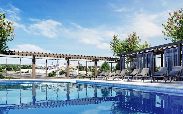 Luxurious pool with cabanas at Gio Apartments, perfect for relaxing in style