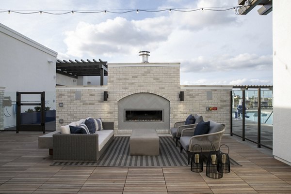 Gio Apartments: Cozy outdoor fire pit in a luxury setting, perfect for social gatherings and relaxation evenings