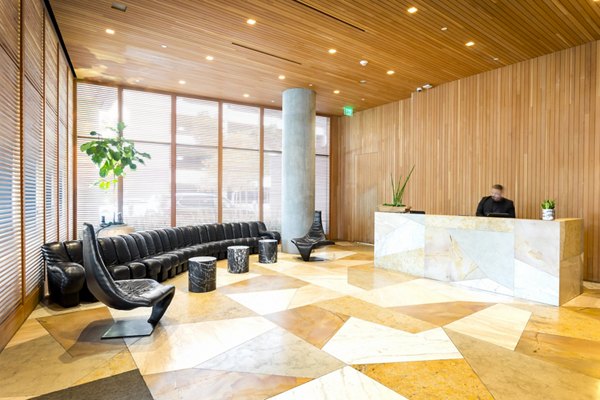 Clubhouse featuring modern design and comfortable seating at Columbia Square Living Apartments