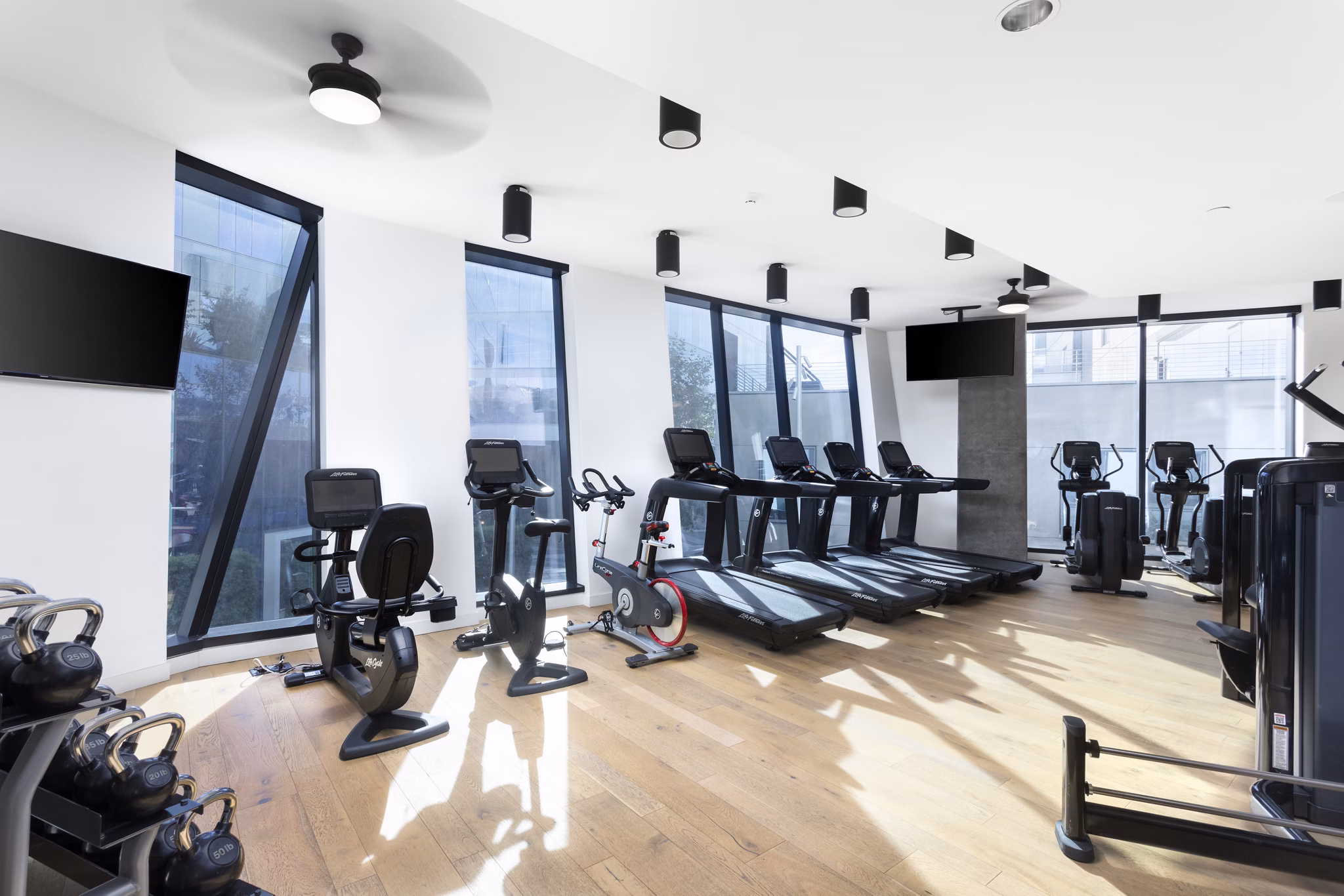 Modern fitness center with state-of-the-art equipment at Columbia Square Living Apartments