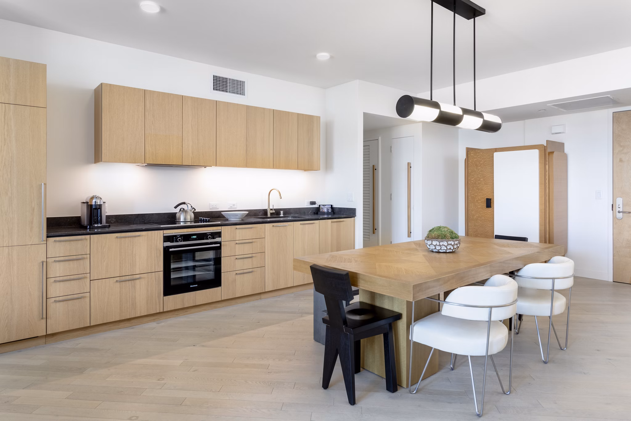 Columbia Square Living Apartments: Modern kitchen with stainless steel appliances and granite countertops