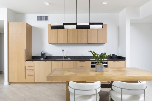 Modern kitchen with stainless steel appliances in Columbia Square Living Apartments