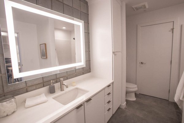 Bathroom featuring modern fixtures and sleek design at The Morton Apartments