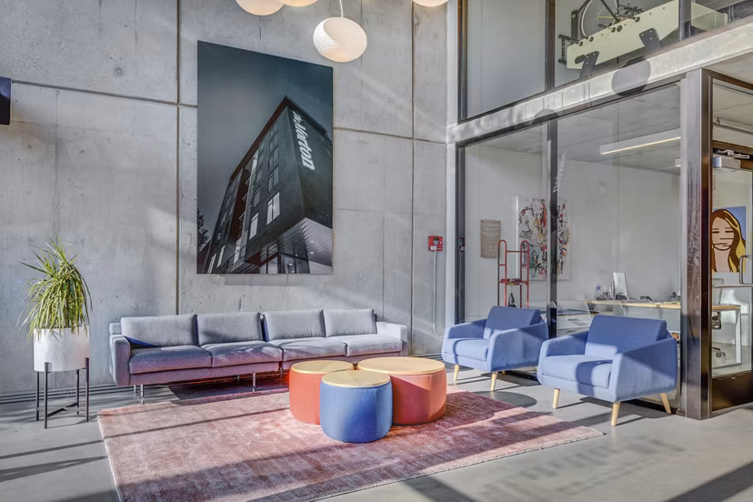 Clubhouse featuring modern design and cozy seating at The Morton Apartments