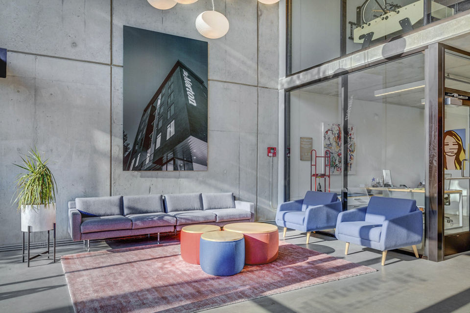 Clubhouse featuring modern design and cozy seating at The Morton Apartments