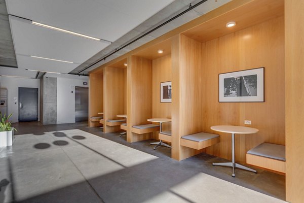 Clubhouse featuring a modern design and social seating at The Morton Apartments