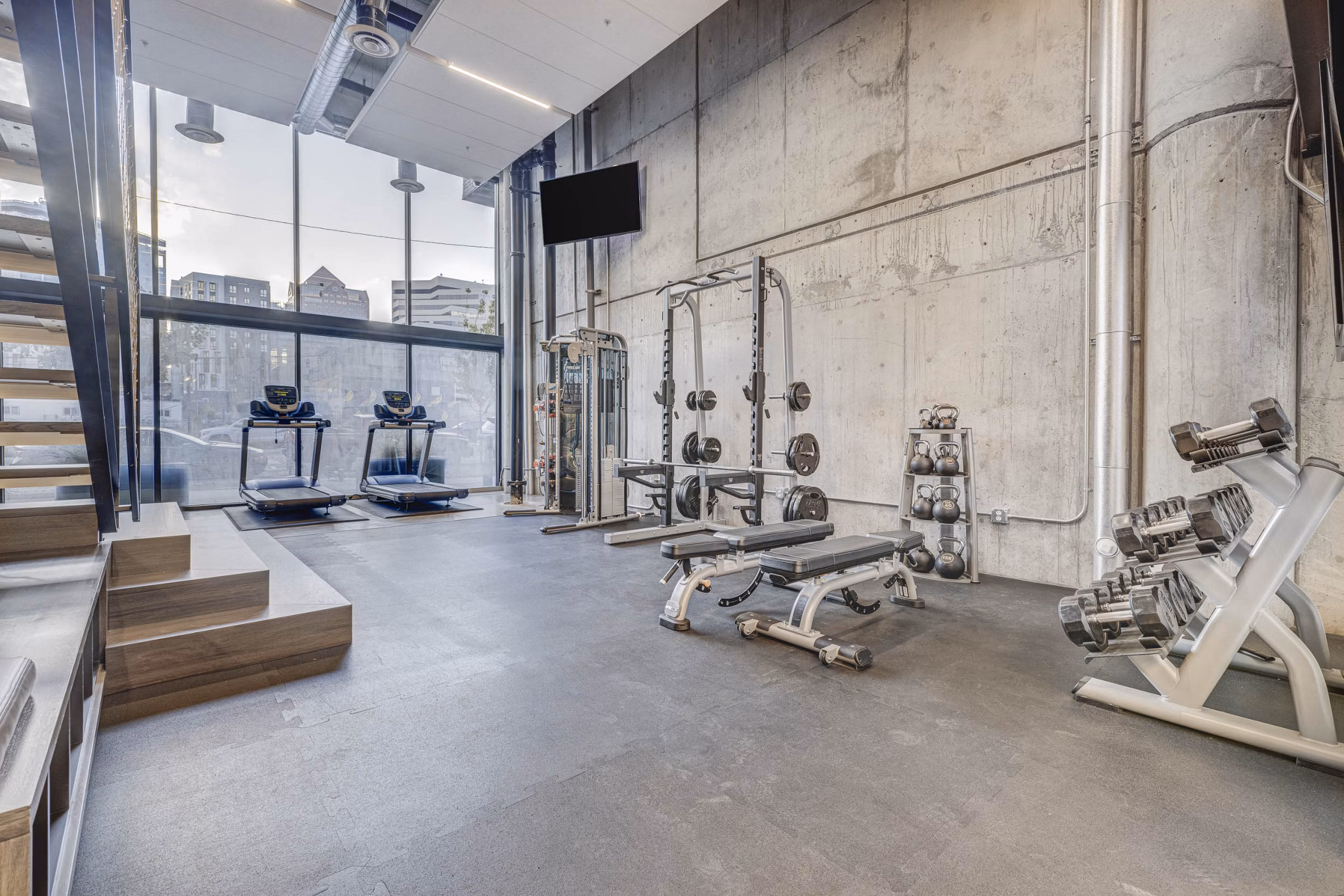 Yoga/spin studio with modern equipment at The Morton Apartments, offering fitness facilities for residents to stay active and healthy