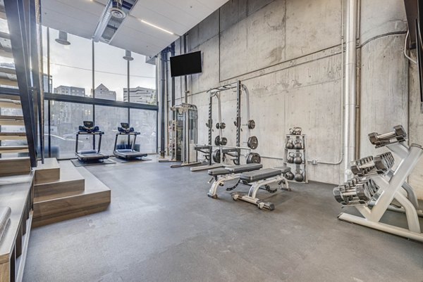 Yoga/spin studio with modern equipment at The Morton Apartments, offering fitness facilities for residents to stay active and healthy