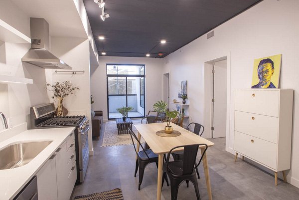 Modern kitchen featuring stainless steel appliances in The Morton Apartments