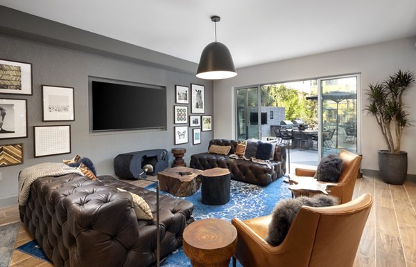 Lex Center City Apartments: Modern clubhouse with stylish seating and entertainment areas