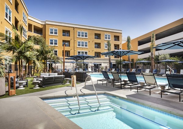Relaxing outdoor pool area at Lex CTR City Apartments, featuring lounging areas and modern design for luxury living in the heart of the city