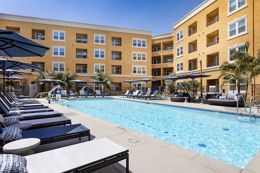 Luxurious rooftop pool with city skyline views at Lex CTR City Apartments