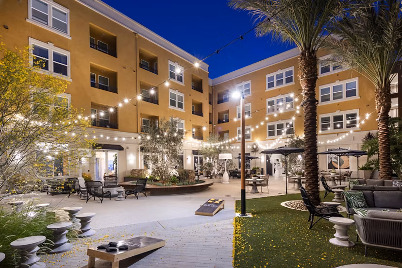 Chic courtyard with lush landscaping at Lex CTR City Apartments, a luxury Greystar community featuring modern outdoor seating