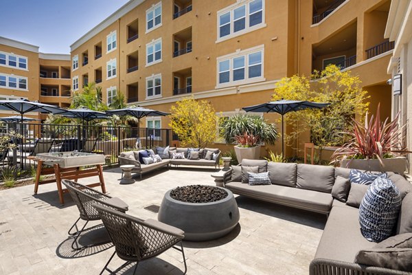 Cozy outdoor fire pit at Lex CTR City Apartments, perfect for relaxing evenings and social gatherings in a luxury setting
