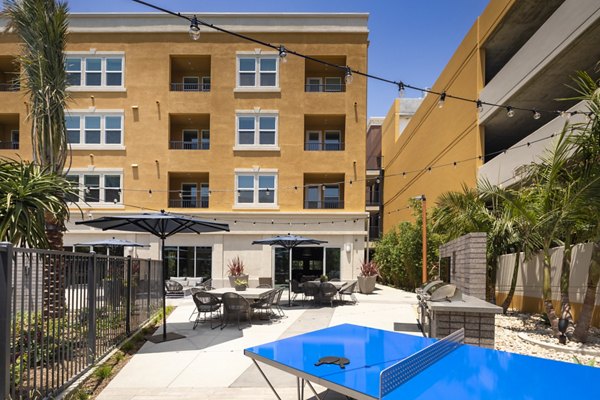 Tranquil courtyard with lush greenery at Lex CTR City Apartments, offering a peaceful retreat in the heart of luxury living