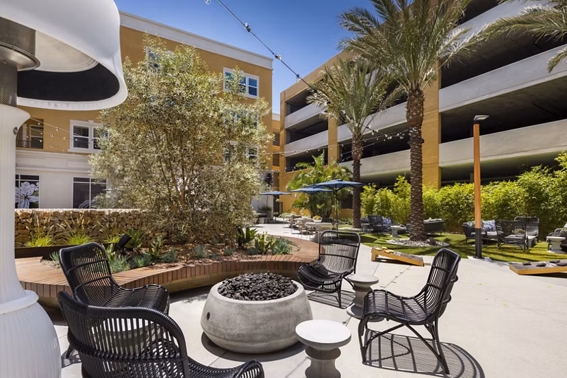 Fire pit lounge area at Lex CTR City Apartments, featuring stylish seating for outdoor relaxation