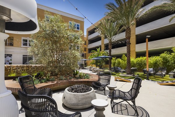 Fire pit lounge area at Lex CTR City Apartments, featuring stylish seating for outdoor relaxation