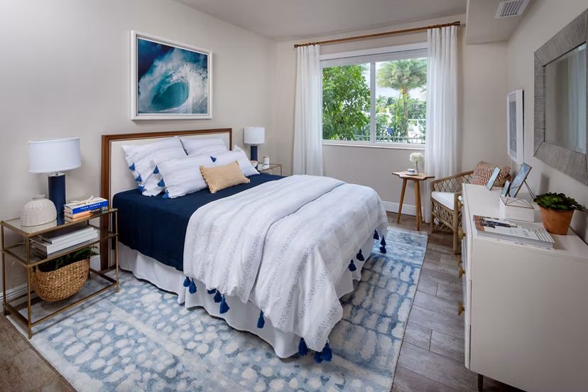 Elegant bedroom with ocean views at 1333 South Ocean Apartments, featuring a serene ambiance and modern design