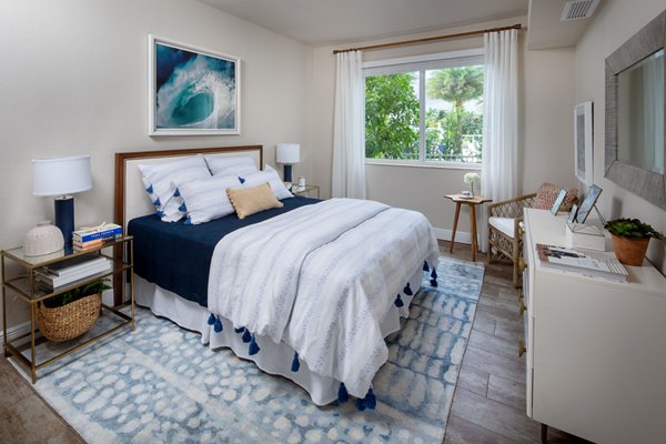 Elegant bedroom with ocean views at 1333 South Ocean Apartments, featuring a serene ambiance and modern design
