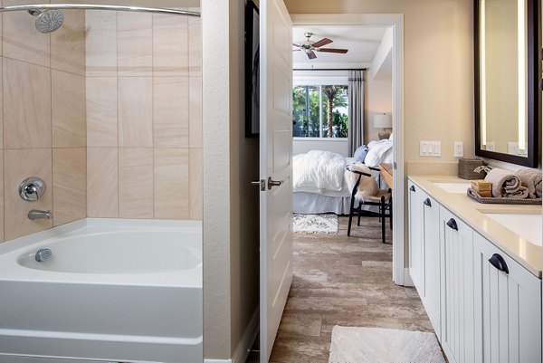 Bathroom featuring sleek fixtures and a modern design at 1333 South Ocean Apartments, luxury living by the beach