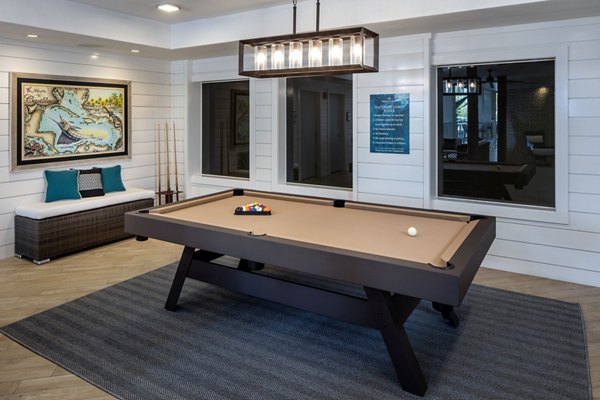 Vibrant game room with pool table and lounge seating at 1333 South Ocean Apartments
