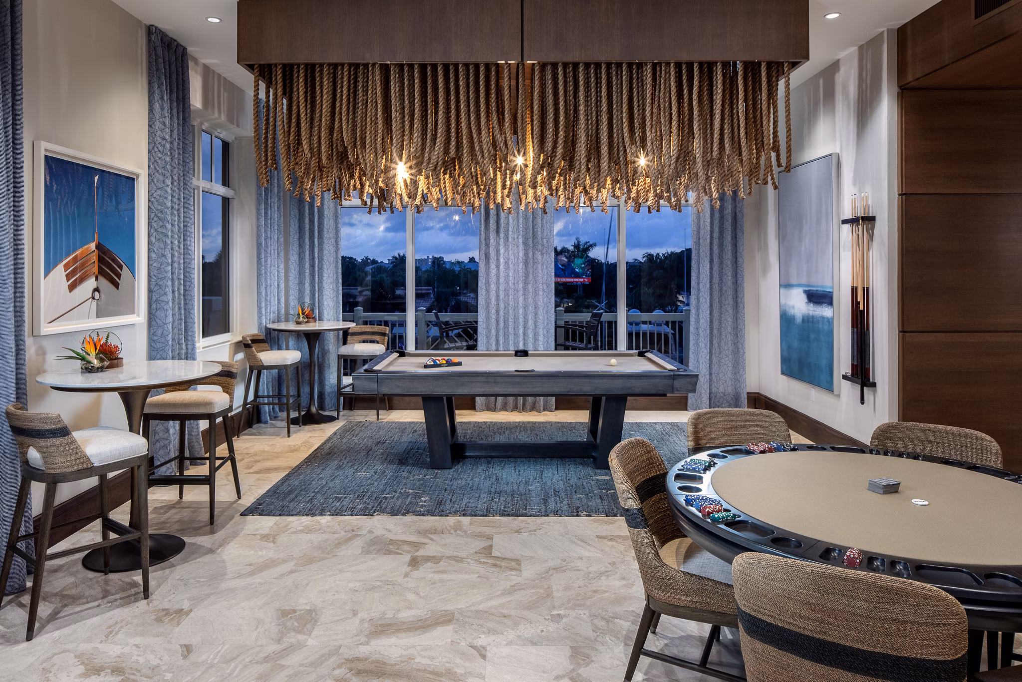 Game room with pool table and lounge chairs at 1333 South Ocean Apartments