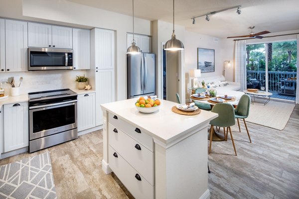 Modern kitchen with stainless steel appliances at South Ocean Apartments, luxury living near the coast