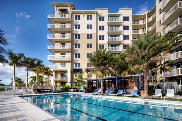 Luxury beachfront pool at 1333 South Ocean Apartments offering ocean views and modern loungers