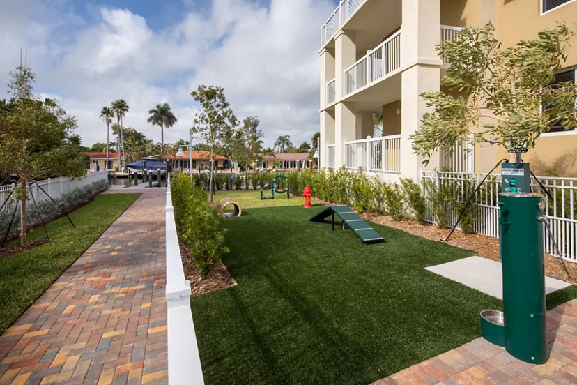 Dog park with agility equipment at 1333 South Ocean Apartments, ideal for pet-friendly living