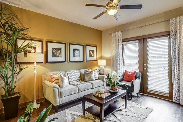 living room at Highpoint at Cypresswood Apartments