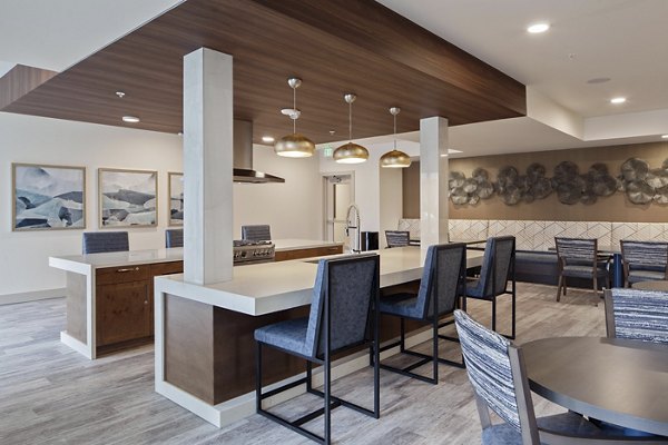 Modern clubhouse featuring cozy lounge areas at Marvelle at Southcenter Apartments