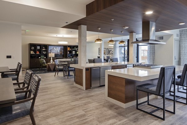Clubhouse at Marvelle at Southcenter Apartments featuring modern design and cozy seating areas for residents to relax and socialize
