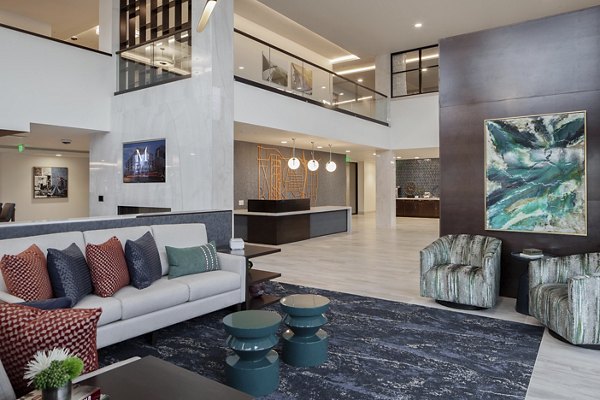 Elegant clubhouse with plush seating and modern decor at Marvelle at Southcenter Apartments
