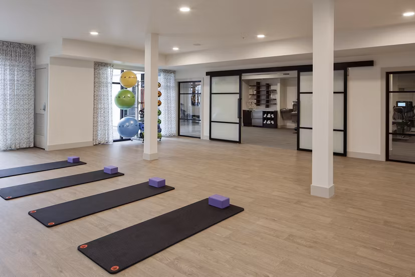 Yoga/spin studio with modern equipment at Marvelle at Southcenter Apartments' fitness center