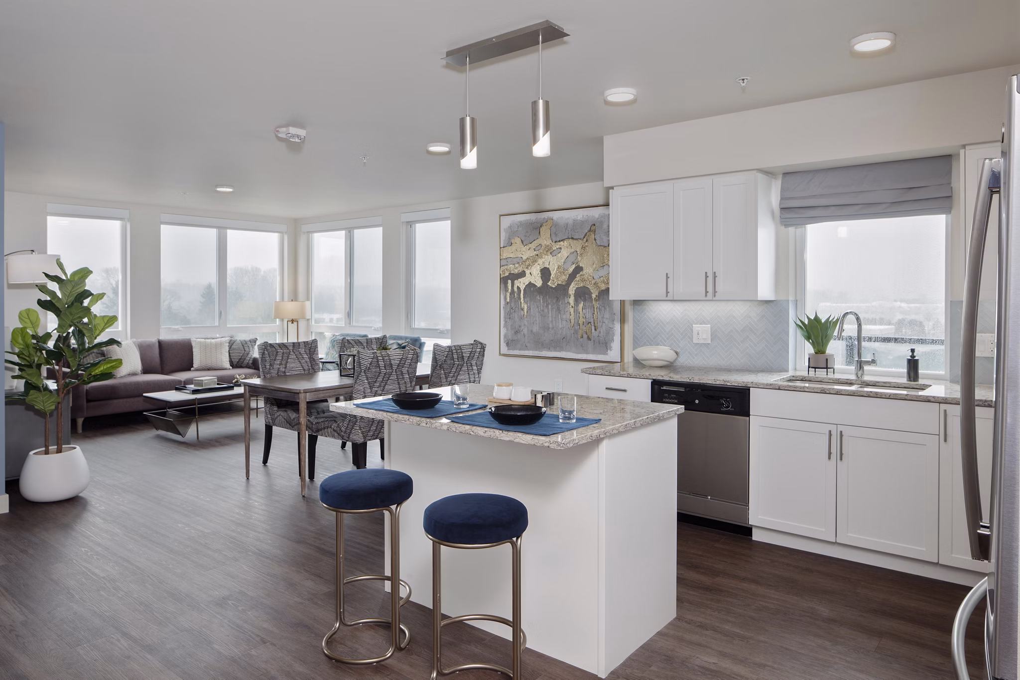 Modern kitchen with stainless steel appliances in Marvelle at Southcenter Apartments