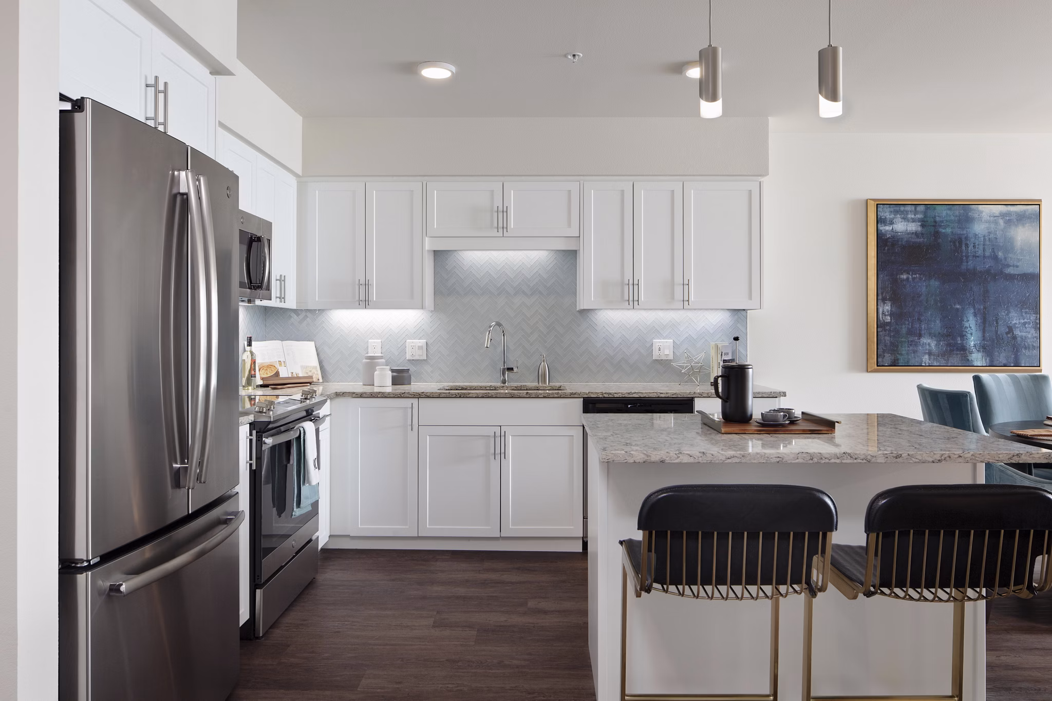 Modern kitchen featuring stainless steel appliances in Marvelle at Southcenter Apartments